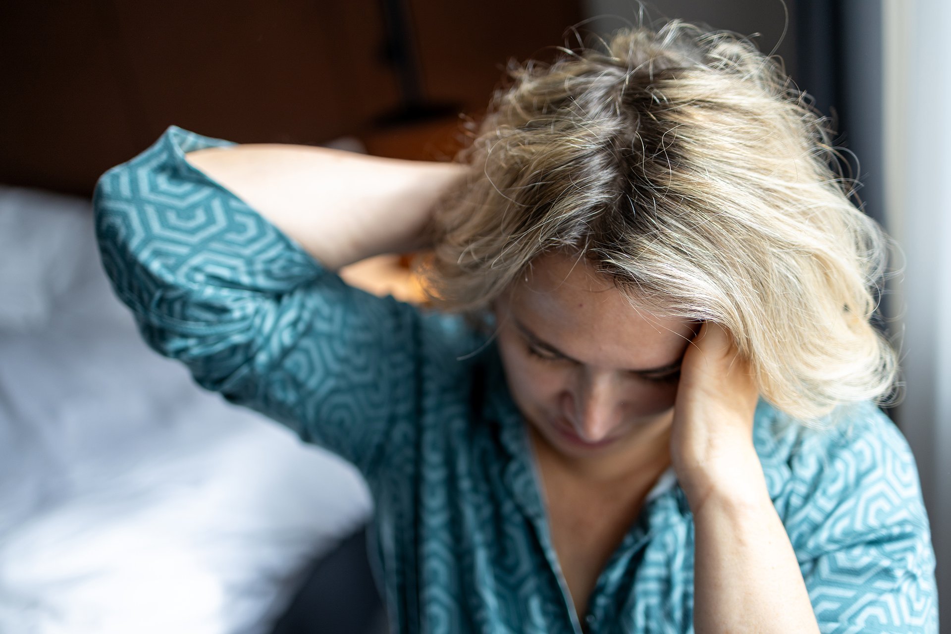 Middle aged woman suffering from migraine