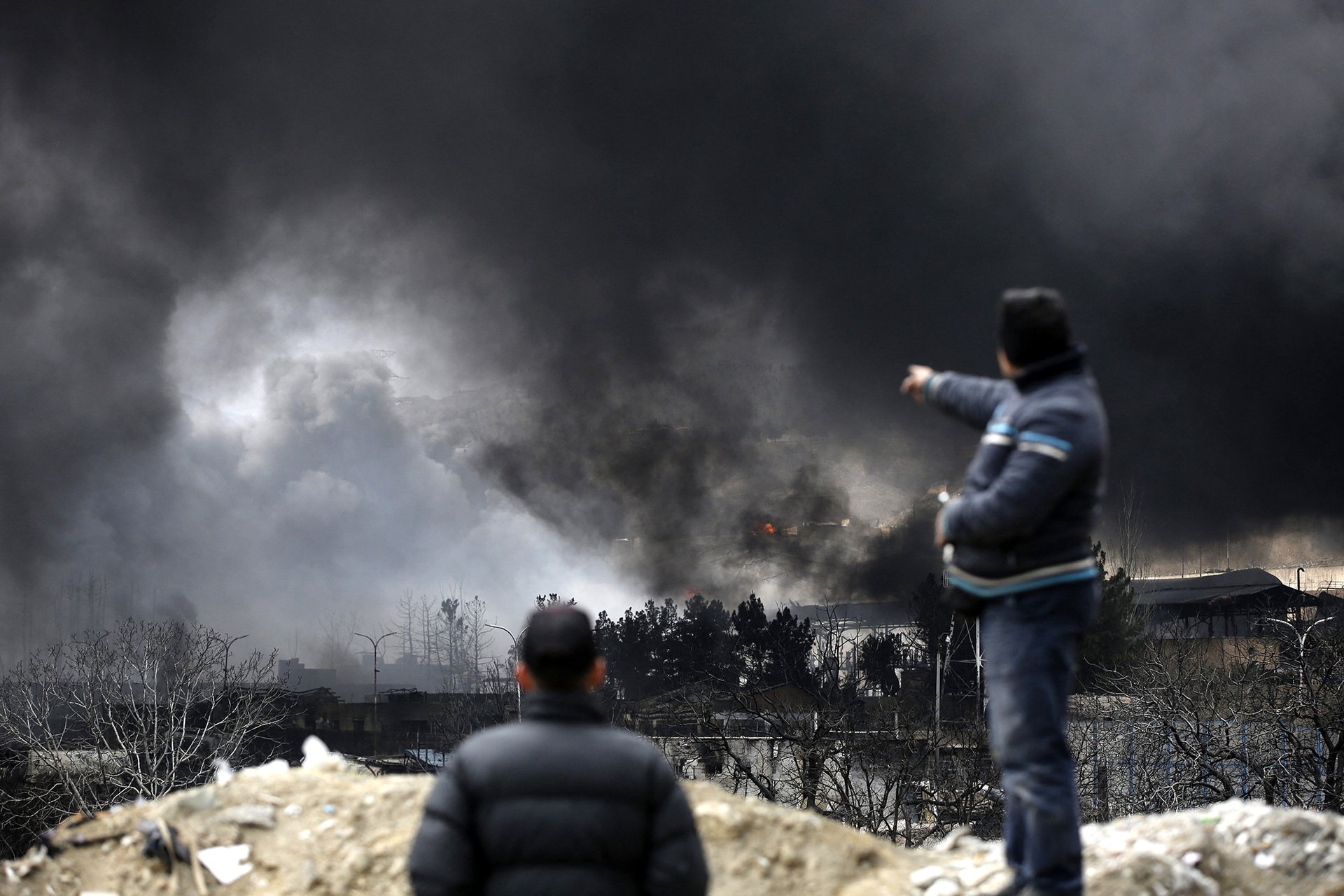 Black smoke rise from the oil depot in Tehran targeted by the US and Israel